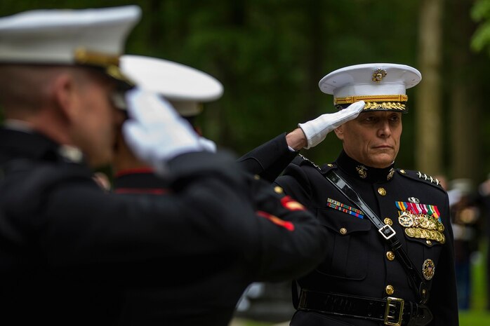 General John M. Paxton, Jr. Assistant Commandant of the Marine Corps salutes while Taps is played, during a private ceremony at Aisne-Marne American Cemetery in Belleau, France, on May 31, 2015. This Memorial Day ceremony was held in honor of the 97th anniversary of the Battle of Belleau Wood. (U.S. Marine Corps photo by Lance Cpl. Akeel Austin/Released)