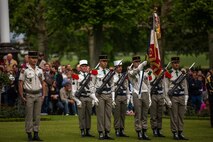 U.S. Marines from the 1st Marine Division and their French counterparts gather at Aisne-Marne American Cemetery to commemorate their fallen heroes in Belleau, France on May 31, 2015. This Memorial Day ceremony was held in honor of the 97th anniversary of the Battle of Belleau Wood. (U.S. Marine Corps photo by Lance Cpl. Akeel Austin/Released)