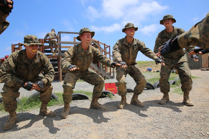 Recruits of Fox Company, 2nd Recruit Training Battalion, perform squats in a warm up for a body sparring exercise during the Crucible at Marine Corps Base Camp Pendleton, June 2. Recruits of Company F wore protective head gear, groin protectors, gloves and Flak jackets for safety during the exercise. Today, all males recruited from west of the Mississippi are trained at MCRD San Diego. The depot is responsible for training more than 16,000 recruits annually. Company F is scheduled to graduate from recruit training on June 12.