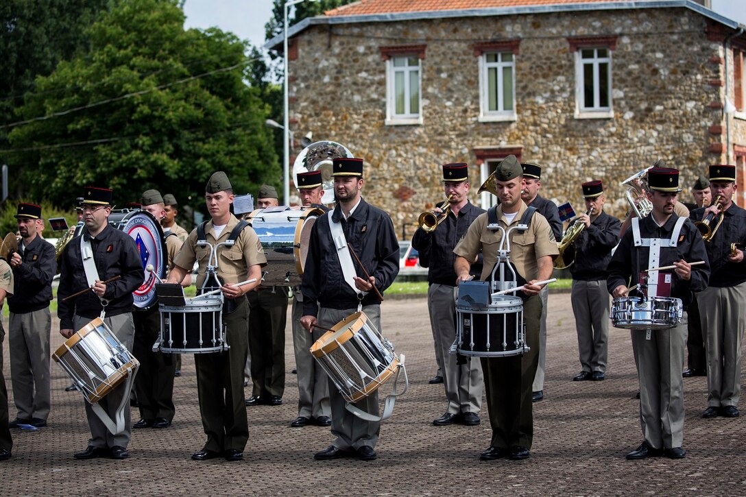 U.S. Marines with the 1st Marine Division Band rehearse with the Band De La Troupe Des Marines on Camp de Satory, Versailles, France, May 26, 2015. The 1st Marine Division Band rehearsed along side the Band De La Troupe Des Marines to prepare for the upcoming Belleau Wood anniversary ceremony. (U.S. Marine Corps photo by Sgt. Luis A. Vega/Released)