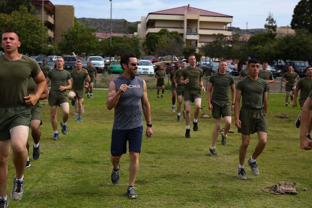 Tony Horton, the creator of P90X, instructs morning physical fitness for the Marines assigned to 3rd Battalion, 5th Marine Regiment, aboard Camp Pendleton, Calif., June 9, 2015. Horton believes Marines need to focus on nutrition and a wide variety of exercises to be ready for any mission as may be directed.