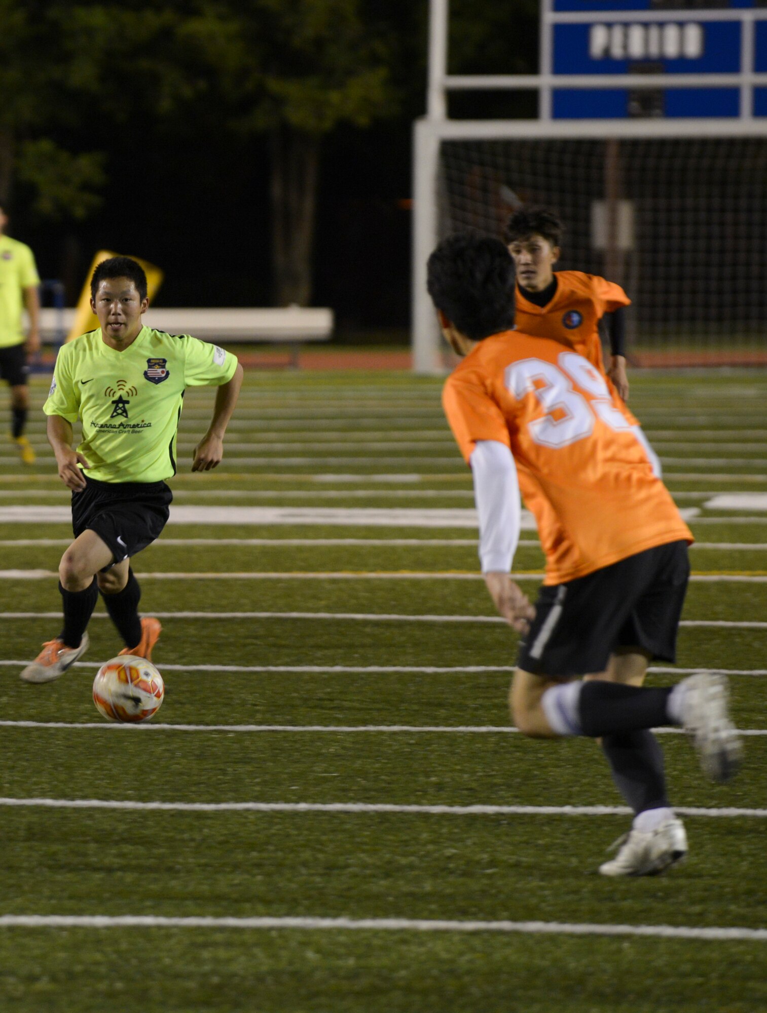 Ryo Oike, FUSSA Football Club player, dribbles the ball up the field during the second half of a soccer game June 7, 2015, at Yokota Air Base, Japan. The team must to win their next game to win their division. (U.S. Air Force photo by Senior Airman David Owsianka/Released)