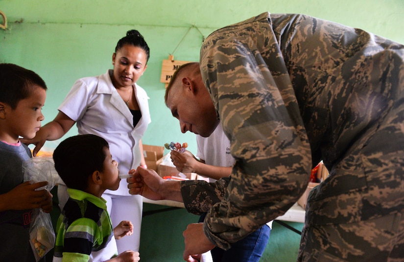 Capt. Christopher Watson, Joint Task Force – Bravo chaplain, administers medication to a patient during the Corinto, Cortes medical readiness training exercise June 2, 2015, at Corinto, Cortes, Honduras. During the MEDRETE more than 667 patients received medical screening, saw medical providers, received dental care, went through preventive medicine and received vaccines. (U.S. Air Force photo by Staff Sgt. Jessica Condit)