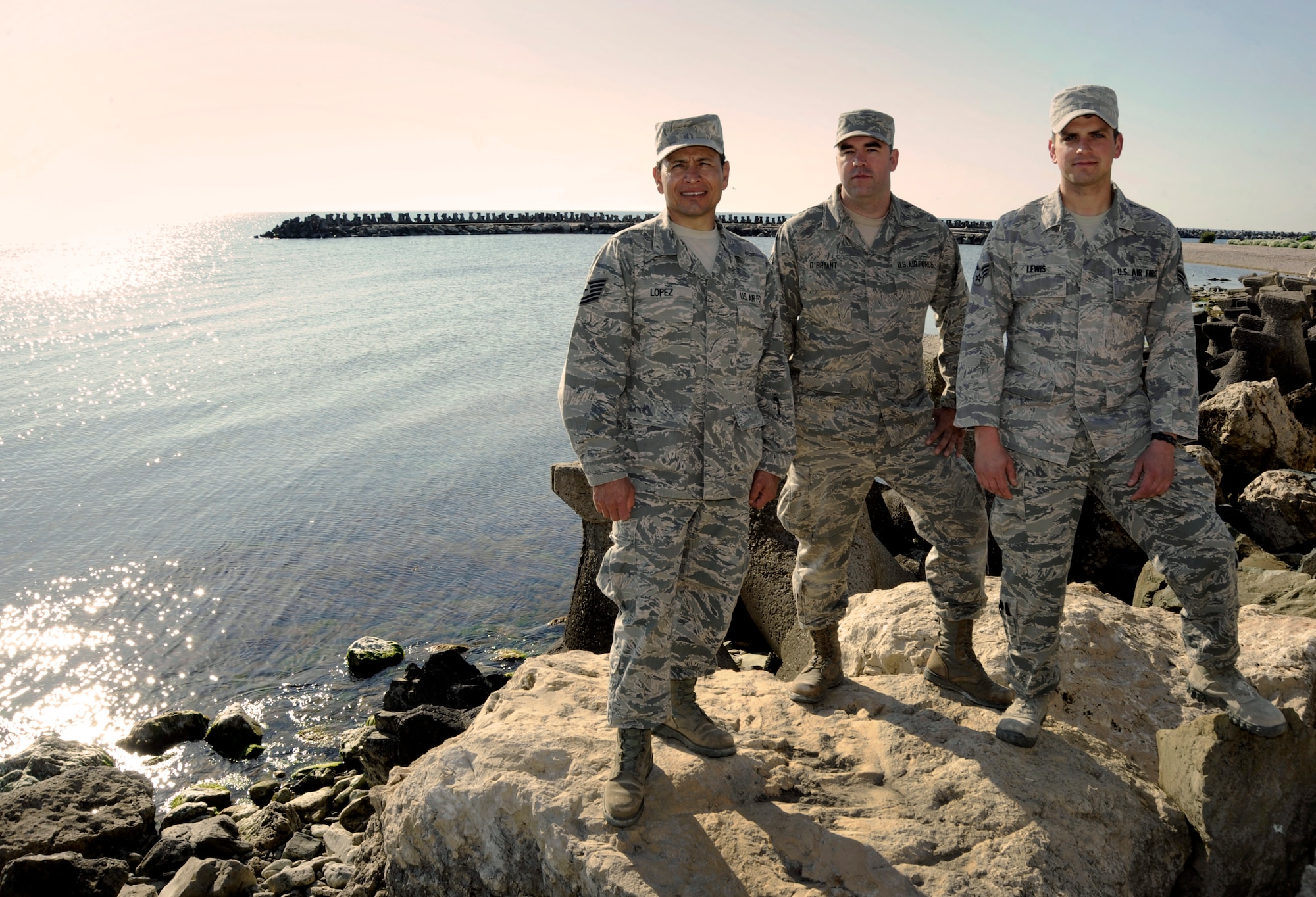 Oregon Air National Guardsmen from the 142nd Fighter Wing Civil Engineer Squadron, Tech. Sgt. Ramon Lopez, left, Senior Airman Tyler O’Bryant, center, and Senior Airman Zachariah Lewis, right, pause for a group photograph along the Black Sea in the City of Mangalia, Romania, May 13, 2015, as part of the U.S. European Command’s (EUCOM) Humanitarian Civic Assistance Program (HCA). The three Airmen on deployment in Romania also recently finished a deployment in Quang Ngai Province, Vietnam, during Operation Pacific Angel, a joint and combined humanitarian assistance operation led by the U.S. Pacific Air Forces. (U.S. Air National Guard photo by Tech. Sgt. John Hughel, 142nd Fighter Wing Public Affairs/Released)