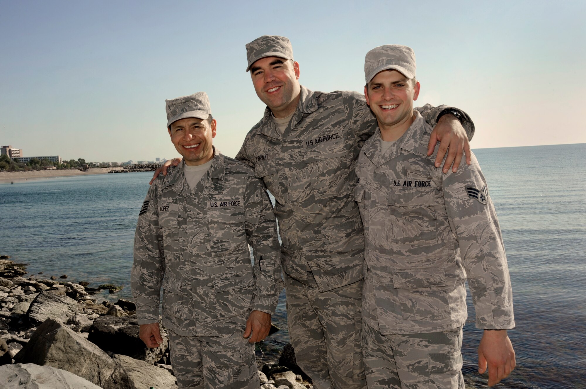 Oregon Air National Guardsmen from the 142nd Fighter Wing Civil Engineer Squadron, Tech. Sgt. Ramon Lopez, left, Senior Airman Tyler O’Bryant, center, and Senior Airman Zachariah Lewis, right, pause for a group photograph along the Black Sea in the City of Mangalia, Romania, May 13, 2015, as part of the U.S. European Command’s (EUCOM) Humanitarian Civic Assistance Program (HCA). The three Airmen on deployment in Romania also recently finished a deployment in Quang Ngai Province, Vietnam, during Operation Pacific Angel, a joint and combined humanitarian assistance operation led by the U.S. Pacific Air Forces. (U.S. Air National Guard photo by Tech. Sgt. John Hughel, 142nd Fighter Wing Public Affairs/Released)