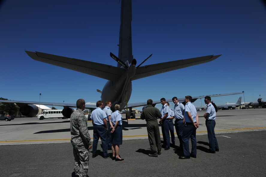 Senior Airman Greg Webb, 92nd Air Refueling Squadron boom operator, shows Royal Canadian Air Cadets the exterior of a KC-135 Stratotanker at Fairchild Air Force Base, Wash., June 5, 2015. Some of the Canadian cadets mentioned that it was their first time on an active duty military base, especially one in a foreign country. (U.S. Air Force photo/Senior Airman Sam Fogleman)