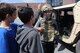 A student from Alder Avenue Middle School in Egg Harbor Township, New Jersey, wears a tactical vest and ballistic helmet before checking out the inside of a humvee from the 227th Air Support Squadron of the New Jersey Air National Guard's 177th Fighter Wing on June 9, 2015. The school's Not All Heroes Wear Capes event provided local first responders and military personnel with the opportunity to provide a hands-on educational experience for students, showing what their services provide the local community. (U.S. Air National Guard photo by Airman 1st Class Amber Powell/Released)