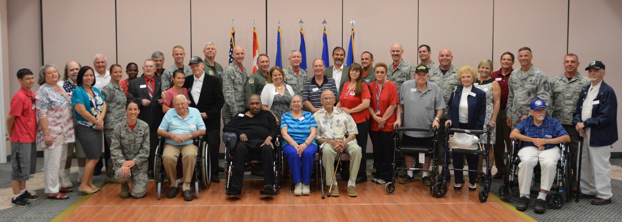 The group of military veteran honorees from World War II and the Korean War join with their escorts for a group photo at the 1st Air Force (Air Forces Northern) “Salute to Vets 2015” event May 29 at the Heritage Club at Tyndall Air Force Base. (Air Force Photo Released/Maj. Katrina Andrews)