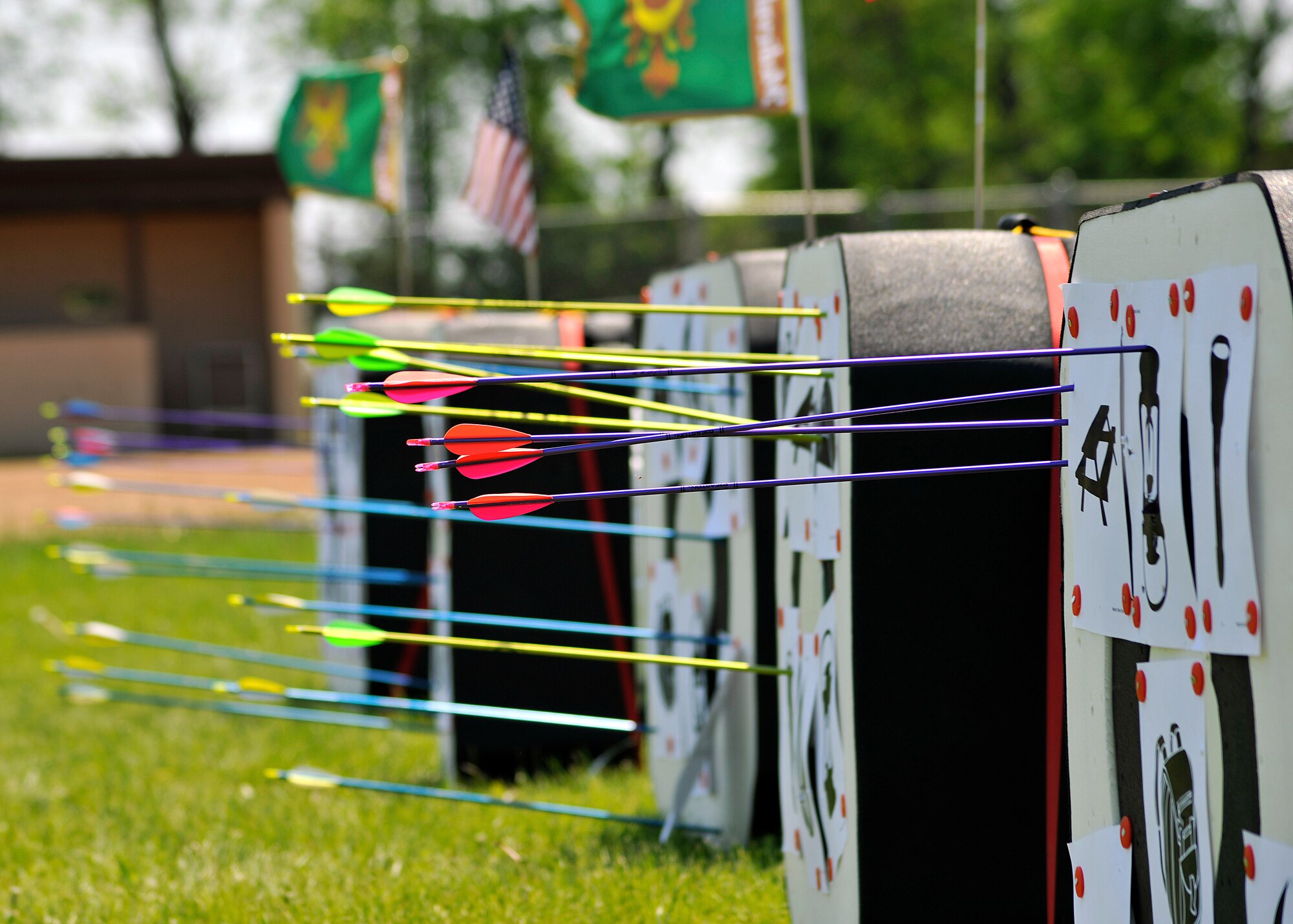 Targets that help focusing techniques stand full of arrows during an archery camp June 9, 2015, on Grand Forks Air Force Base, N.D. Students played a mystery shoot game where one a teammate selected a card and another teammate asked questions to determine which object to shoot. (U.S. Air Force photo by Senior Airman Xavier Navarro/released)
