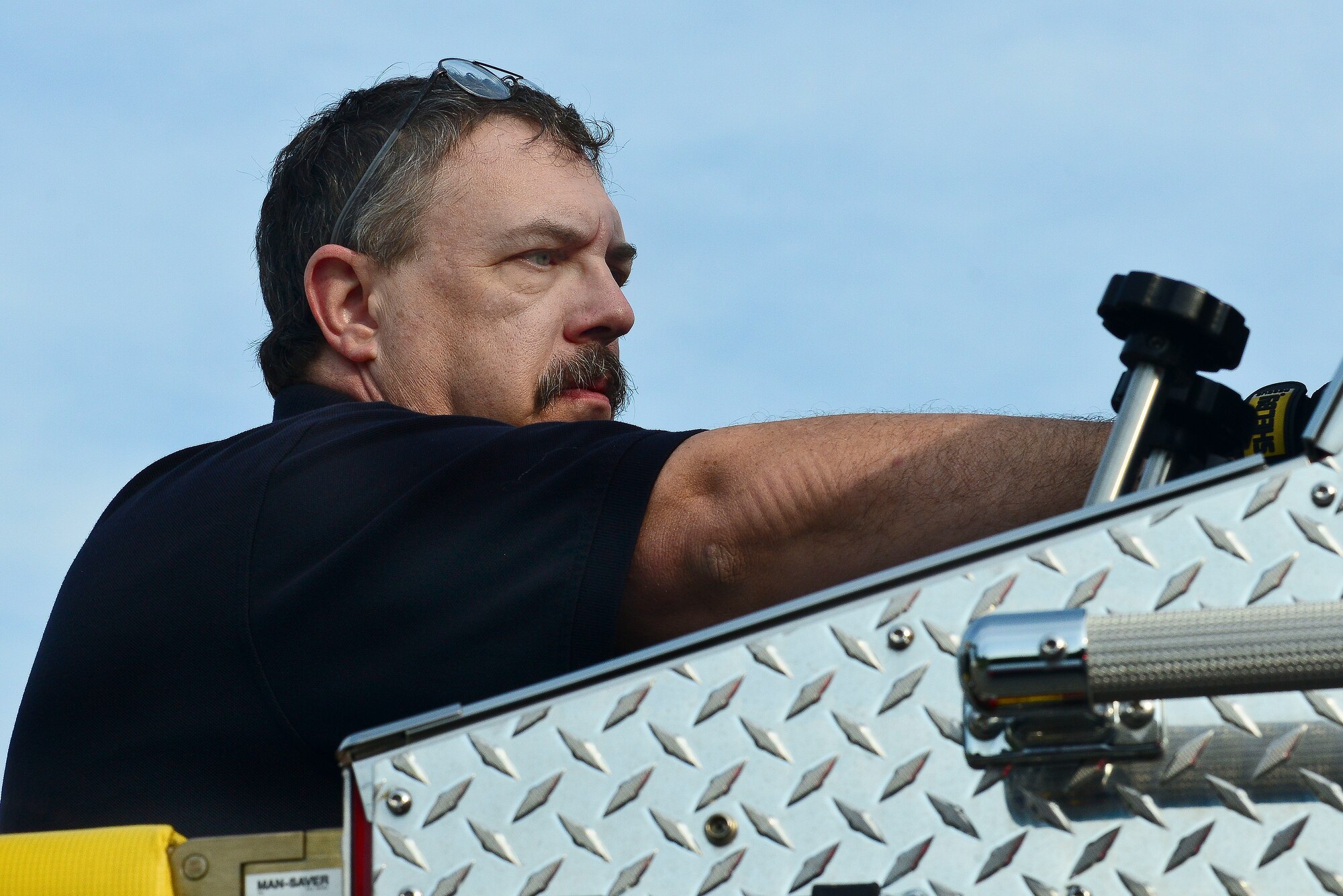 Walter Williams, 733rd Civil Engineer Division Fort Eustis Fire Department firefighter, inspects water gages on a fire truck at Fort Eustis, Va., June 8, 2015.Checking all the different aspects of the truck including the water gages are important to insure they are working in proper order in the event of an emergency.  (U.S. Air Force photo by Senior Airman Kimberly Nagle/Released)  