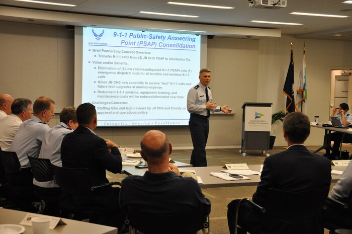 Lieutenant Col. Warren Brainard gives a briefing during the P4 Community Partnering Final Planning Meeting June 5, 2015 at the Charleston Chamber of Commerce in North Charleston, S.C. Both base leadership and local community members have been working over the last several months in groups to look at and develop creative ways to leverage capabilities and resources, combine like services, and improve the quality of life for those who call Charleston home. The Final Planning Meeting, also called the “Realities Workshop,” was the third workshop held and provided a forum for the group to review 10 potential initiatives and areas for partnership. Brainard is the 628th Security Forces Squadron commander. (U.S. Air Force photo by Michaela Judge) - 31