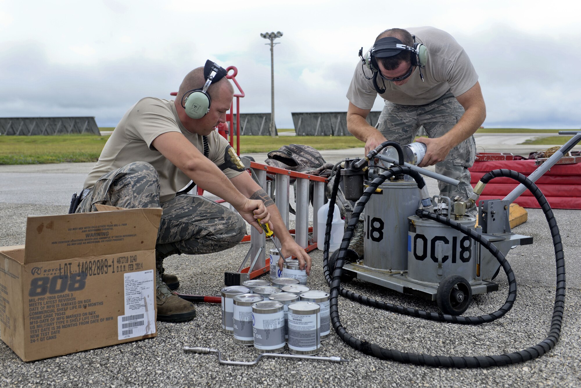 Tech. Sgt. Brian Luther and Staff Sgt. Chris Graham refill an oil cart prior to launching a B-1B Lancer May 8, 2015, at Andersen Air Force Base, Guam. The B-1s recently conducted test and training missions in the Asia-Pacific region to validate the modified jet's long-range strike capability and to further develop maritime tactics, techniques and procedures for the airframe. Luther and Graham are assigned to the 9th Aircraft Maintenance Unit at Dyess Air Force Base, Texas. (U.S. Air Force photo by Senior Airman Katrina M. Brisbin/Released)