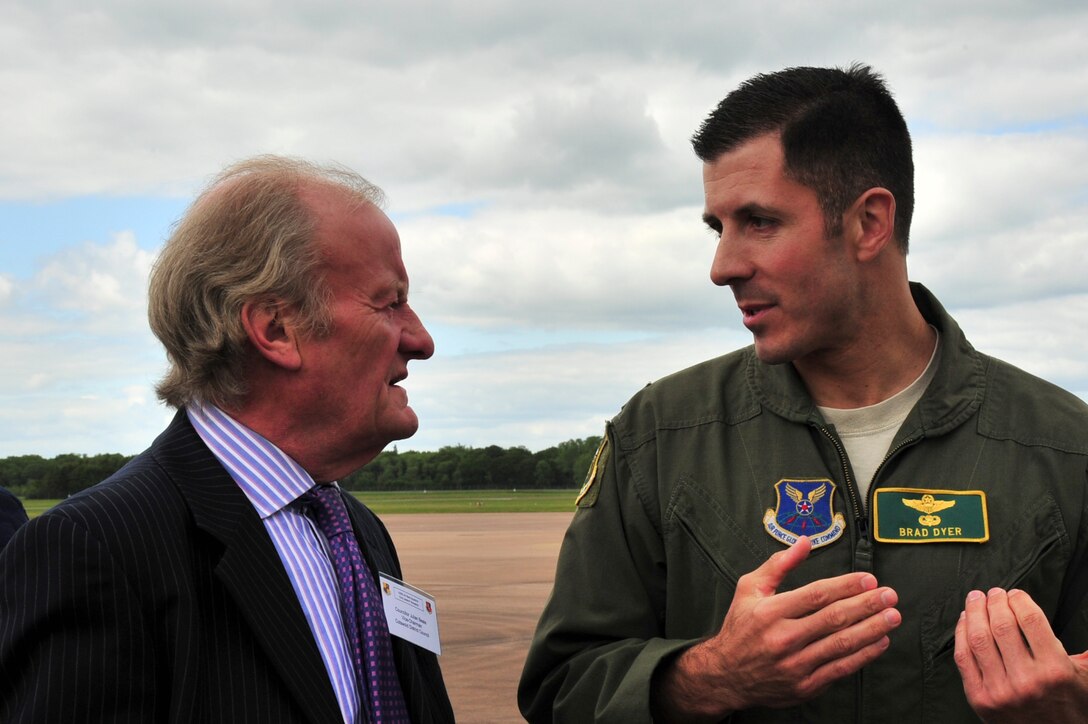 Lt. Col. Bradley Dyer, 23rd Expeditionary Bomb Squadron commander, discusses the mission of the B-52H Stratofortress with a local civic leader who visited Royal Air Force Fairford, England, June 9, 2015. The civic leaders came to the base to learn about the B-52 and its capabilities as well as how the pilots operate the 50 year-old aircraft. While at RAF Fairford, the bombers conducted training flights with ground and naval forces around the region and participate, in multi-national exercises BALTOPS 15 and Saber Strike 15. (U.S. Air Force photo/Senior Airman Malia Jenkins)  