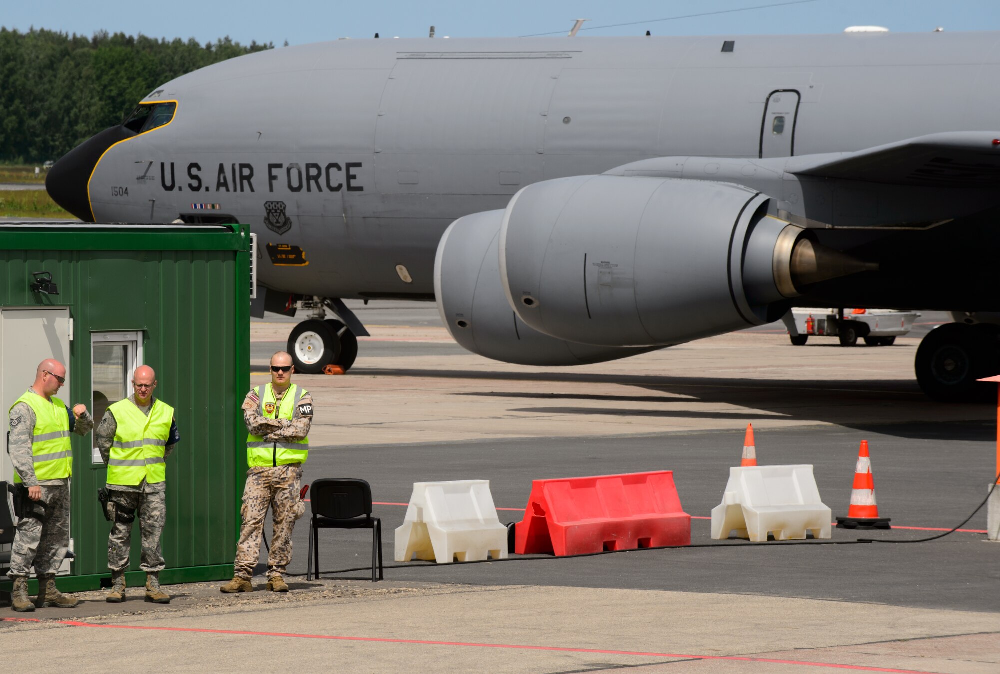 Michigan Air National Guard security forces member and Latvian Air Forces military police members guard two KC-135 Stratotankers on the Riga International Airport, Latvia, flightline prior to a sortie in support of Saber Strike 15 June 9, 2015. Guardsmen from Maryland, Michigan and Pennsylvania came together to support Saber Strike 15 by providing aerial-refueling and close air support. Saber Strike 15 is a joint and multinational exercise designed to promote stability in the Baltic area and provide an opportunity for military members to sharpen their skills. (U.S. Air Force photo/ Staff Sgt. Armando A. Schwier-Morales)