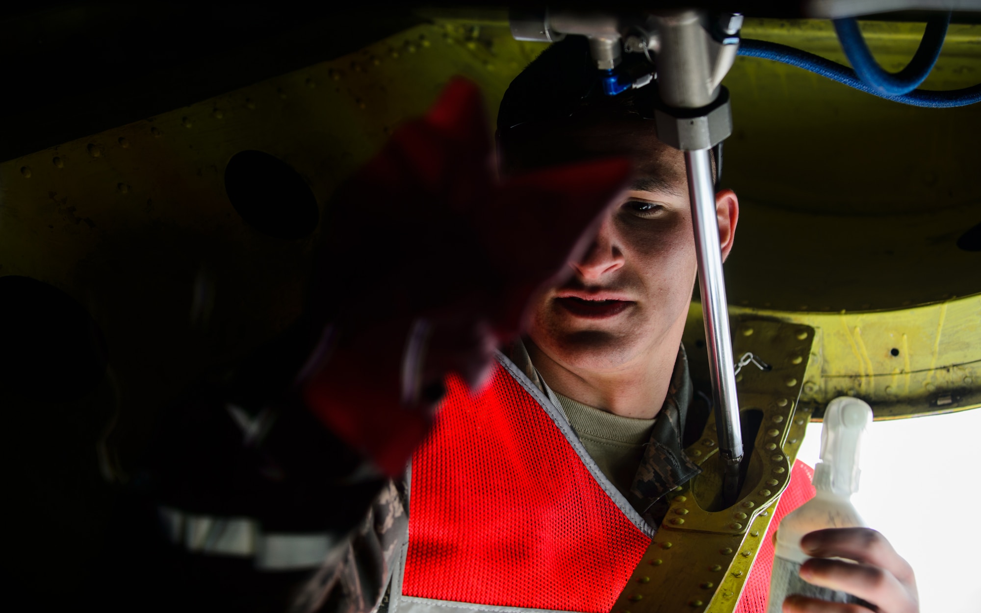 Senior Airman Anthony Palombo, Pennsylvania Air National Guard crew chief, cleans the window used by the boom operator on a KC-135 Stratotanker June 9, 2015 at Riga International Airport, Latvia. Guardsmen from Maryland, Michigan and Pennsylvania came together to support Saber Strike 15 by providing aerial-refueling and close air support. Saber Strike 15 is a joint and multinational exercise designed to promote stability in the Baltic area and provide an opportunity for military members to sharpen their skills. (U.S. Air Force photo/ Staff Sgt. Armando A. Schwier-Morales)