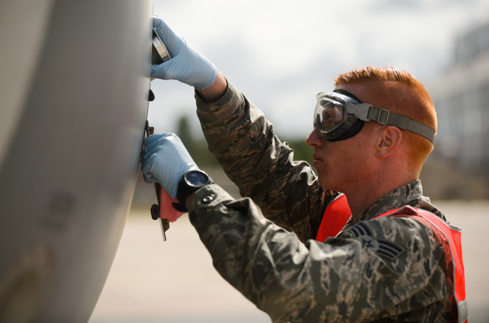 Senior Airman Cody Prelec, Pennsylvania Air National Guard crew chief, changes the oil on a KC-135 Stratotanker engine June 9, 2015 at Riga International Airport, Latvia. Guardsmen from Maryland, Michigan and Pennsylvania came together to support Saber Strike 15 by providing aerial-refueling and close air support. Saber Strike 15 is a joint and multinational exercise designed to promote stability in the Baltic area and provide an opportunity for military members to sharpen their skills. (U.S. Air Force photo/ Staff Sgt. Armando A. Schwier-Morales)