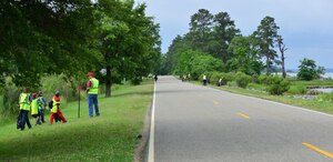 U.S. Service members and their families along with Boy Scouts and Cub Scouts clean the Fort Eustis, Va., shoreline June 6, 2015. Volunteers cleaned the shorelines at Fort Eustis and Langley Air Force Base as a part of Clean the Bay Day, a state-wide conservation effort. (U.S. Air Force photo by Staff Sgt. Natasha Stannard/Released)