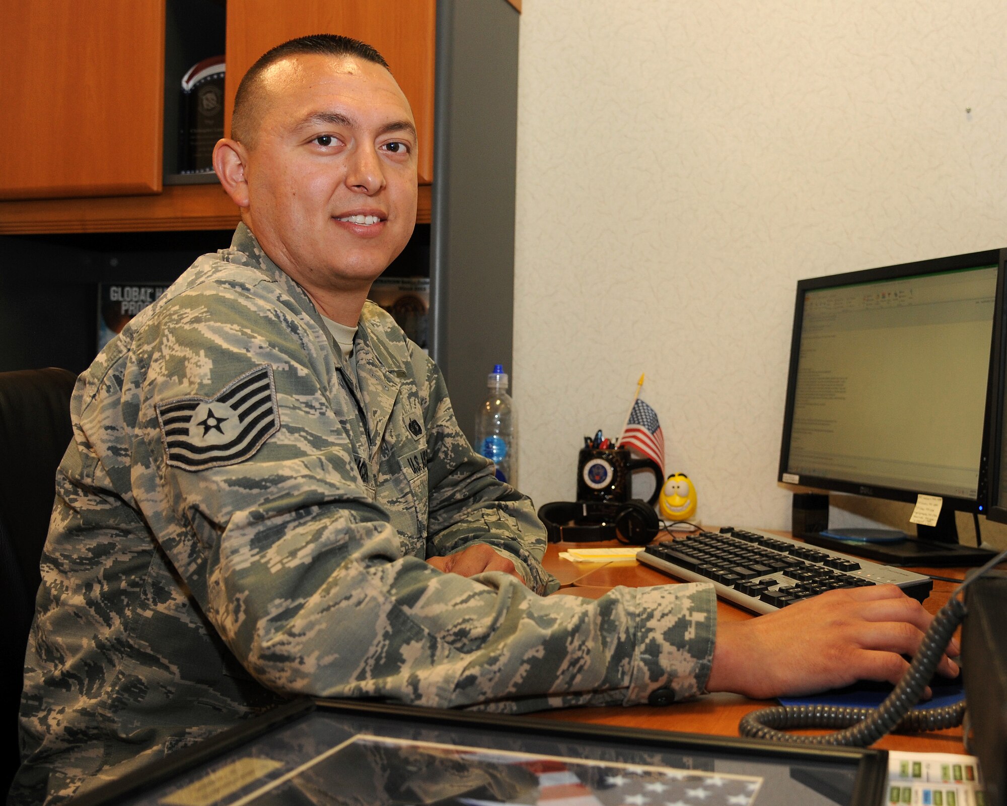 Tech. Sgt. Christopher Lucero, 348th Reconnaissance Squadron flight chief of plans and programs, works to keep personnel records in the squadron up to date June 9, 2015, on Grand Forks Air Force Base, N.D. Lucero was selected as the warrior of the week for the second week of June 2015. (U.S. Air Force photo by Senior Airman Zachiah Roberson/released)