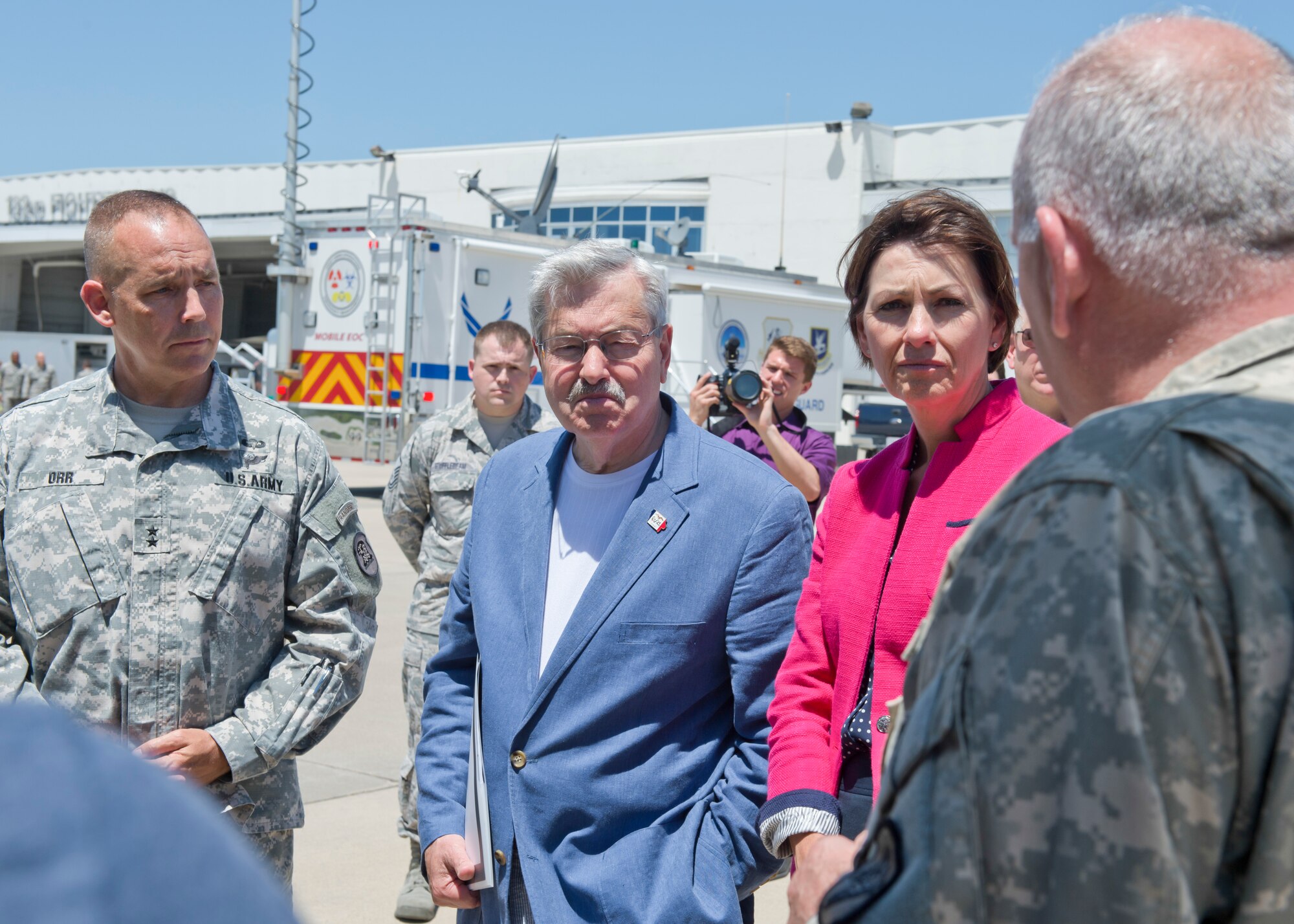 The 132nd Wing, Iowa Air National Guard based in Des Moines, Iowa hosted Iowa Governor Terry Branstad and Lieutenant Governor Kim Reynolds during a tour of the Wing’s capabilities on June 9. Maj. Gen. Timothy Orr, The Adjutant General of Iowa (far left), also attended, as Iowa officials were briefed on the unit’s three new missions – Intelligence Surveillance Reconnaissance, Defensive Cyber Operations, and MQ-9 Remotely Piloted Aircraft flying operations. Iowa Army National Guard Chief Warrant Officer 4 Greg Wilbur explains the capabilities of the Army’s UH-72 Lakota helicopter. (Iowa Air National Guard photo by Tech. Sgt. Linda K. Burger)