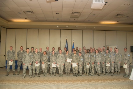 Newly selected Technical Sergeants pose for a group photo after receiving their certificates, June 9, 2015 during the 2015 Tech. Sgt. Release Party at Joint Base Charleston, S.C. JB Charleston had 99 selectees and the Air Force selected 8,446 staff sergeants for promotion to technical sergeant. Selectees represent 23.55 percent of the 35,863 eligible. Airmen selected for technical sergeant will be promoted according to their promotion sequence number beginning in August. Selections are tentative until the data verification process is complete, which is no later than 10 days after the promotion release date.  Personnel officials will notify Airmen, via military personnel sections, if their selection is in question. (U.S. Air Force photo/Senior Airman George Goslin)