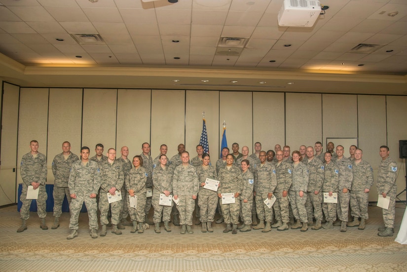 Newly selected Technical Sergeants pose for a group photo after receiving their certificates, June 9, 2015 during the 2015 Tech. Sgt. Release Party at Joint Base Charleston, S.C. JB Charleston had 99 selectees and the Air Force selected 8,446 staff sergeants for promotion to technical sergeant. Selectees represent 23.55 percent of the 35,863 eligible. Airmen selected for technical sergeant will be promoted according to their promotion sequence number beginning in August. Selections are tentative until the data verification process is complete, which is no later than 10 days after the promotion release date.  Personnel officials will notify Airmen, via military personnel sections, if their selection is in question. (U.S. Air Force photo/Senior Airman George Goslin)