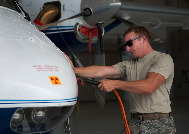 Senior Airman Kristopher Golden, 919th Special Operations Aircraft Maintenance Group, plugs the external power into the C-145 June 6 at Duke Field, Fla. The 919th SOMXG is comprised of 919th SOMXS, 919th SOAMXS, 919th SOMOF, and the 592nd SOMXS.  Their primary mission is the maintenance of the C-145 aircraft.  (U.S. Air Force photo/Tech. Sgt. Jasmin Taylor)