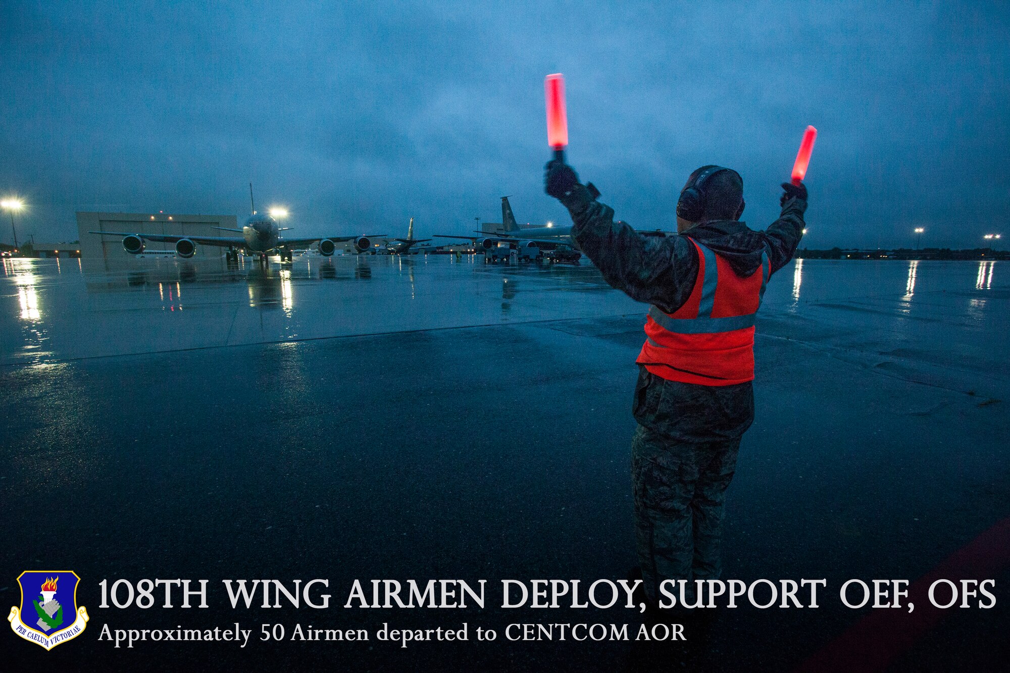 A 108th Wing Airman marshals a departing KC-135 Stratotanker on Joint Base McGuire-Dix-Lakehurst, N.J., June 2, 2015, Approximately 50 Airmen from the 108th Wing deployed to the Central Command area of responsibility in support of Operations Enduring Freedom and Freedom's Sentinel. (U.S. Air National Guard photo by Master Sgt. Mark C. Olsen/Released)
