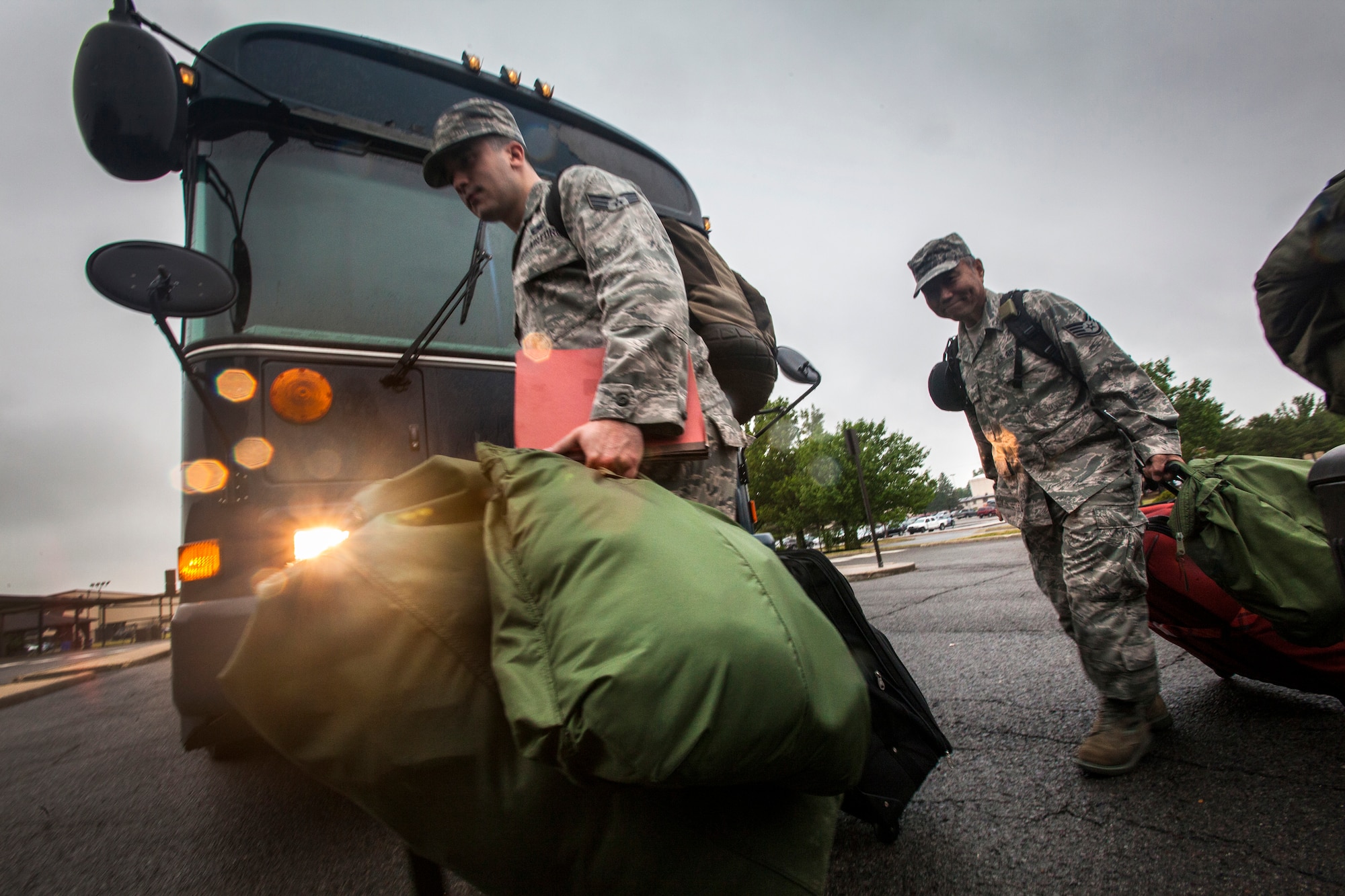 Airmen with the 108th Wing, New Jersey Air National Guard, take bags into the passenger terminal on Joint Base McGuire-Dix-Lakehurst, N.J., June 2, 2015. Approximately 50 Airmen from the 108th Wing deployed to the Central Command area of responsibility in support of Operations Enduring Freedom and Freedom's Sentinel. (U.S. Air National Guard photo by Master Sgt. Mark C. Olsen/Released)
