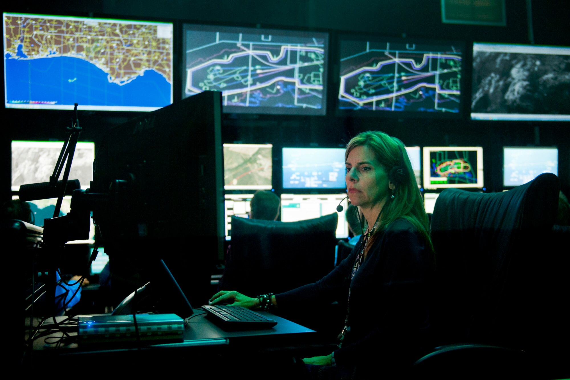 Reeda Buglewicz, 96th Range Control Squadron, monitors a test from the central control facility at Eglin Air Force Base, Fla., April 6.  The 96th RCS through its CCF provides real-time mission control of airborne test and large force training missions on the Eglin Test and Training Range. The CCF is a state-of-the-art facility analogous to NASA’s mission control but on a smaller scale. Operations involve the real-time tracking and control of aircraft and weapons in flight, data collection, and data processing for real-time and post-mission system under test performance analysis. (U.S. Air Force photo/Samuel King Jr.)