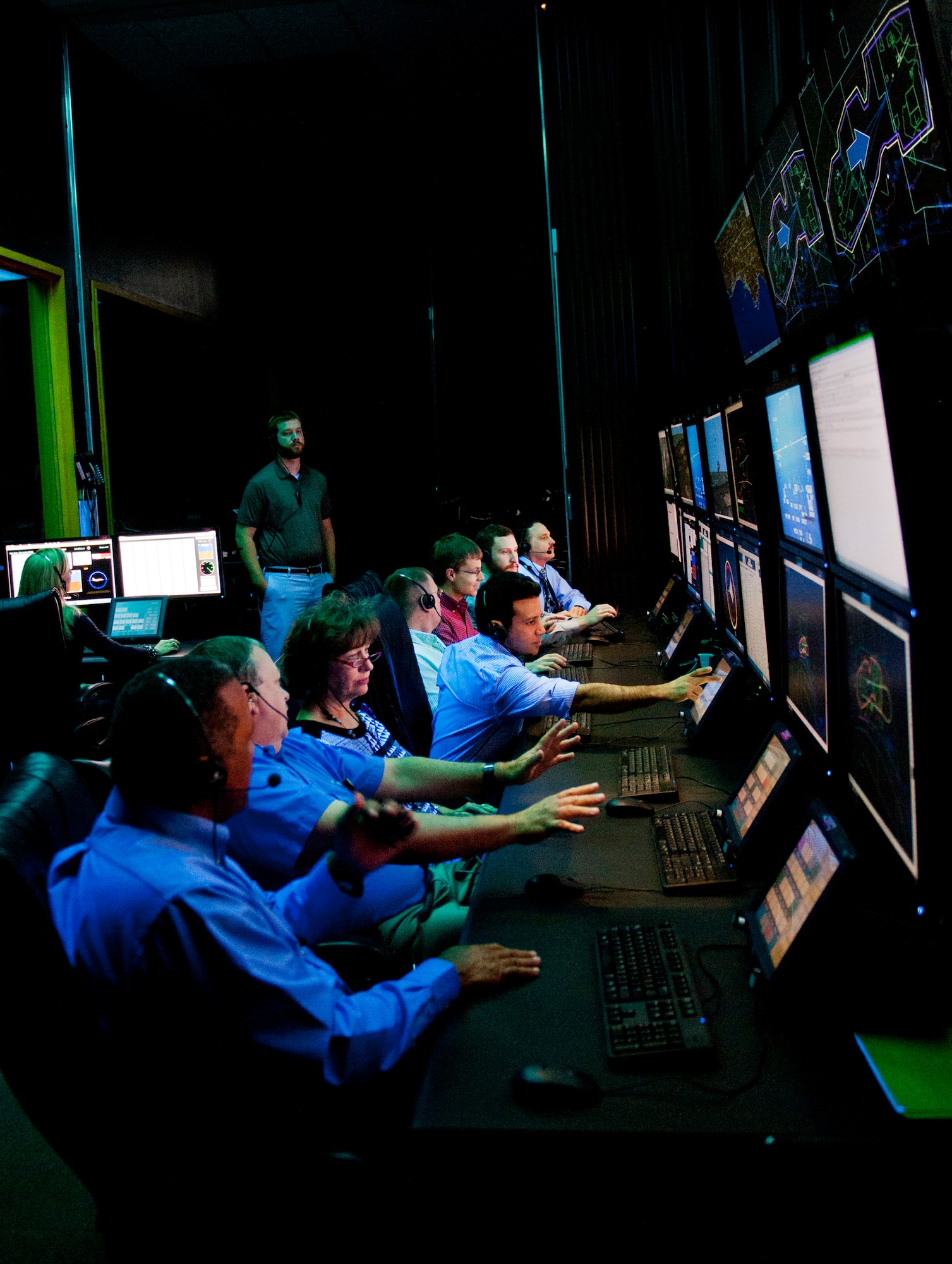 Members of the 96th Range Control Squadron monitor a test from the central control facility at Eglin Air Force Base, Fla., April 6.  The 96th RCS through its CCF provides real-time mission control of airborne test and large force training missions on the Eglin Test and Training Range. The CCF is a state-of-the-art facility analogous to NASA’s mission control but on a smaller scale. Operations involve the real-time tracking and control of aircraft and weapons in flight, data collection, and data processing for real-time and post-mission system under test performance analysis. (U.S. Air Force photo/Samuel King Jr.)