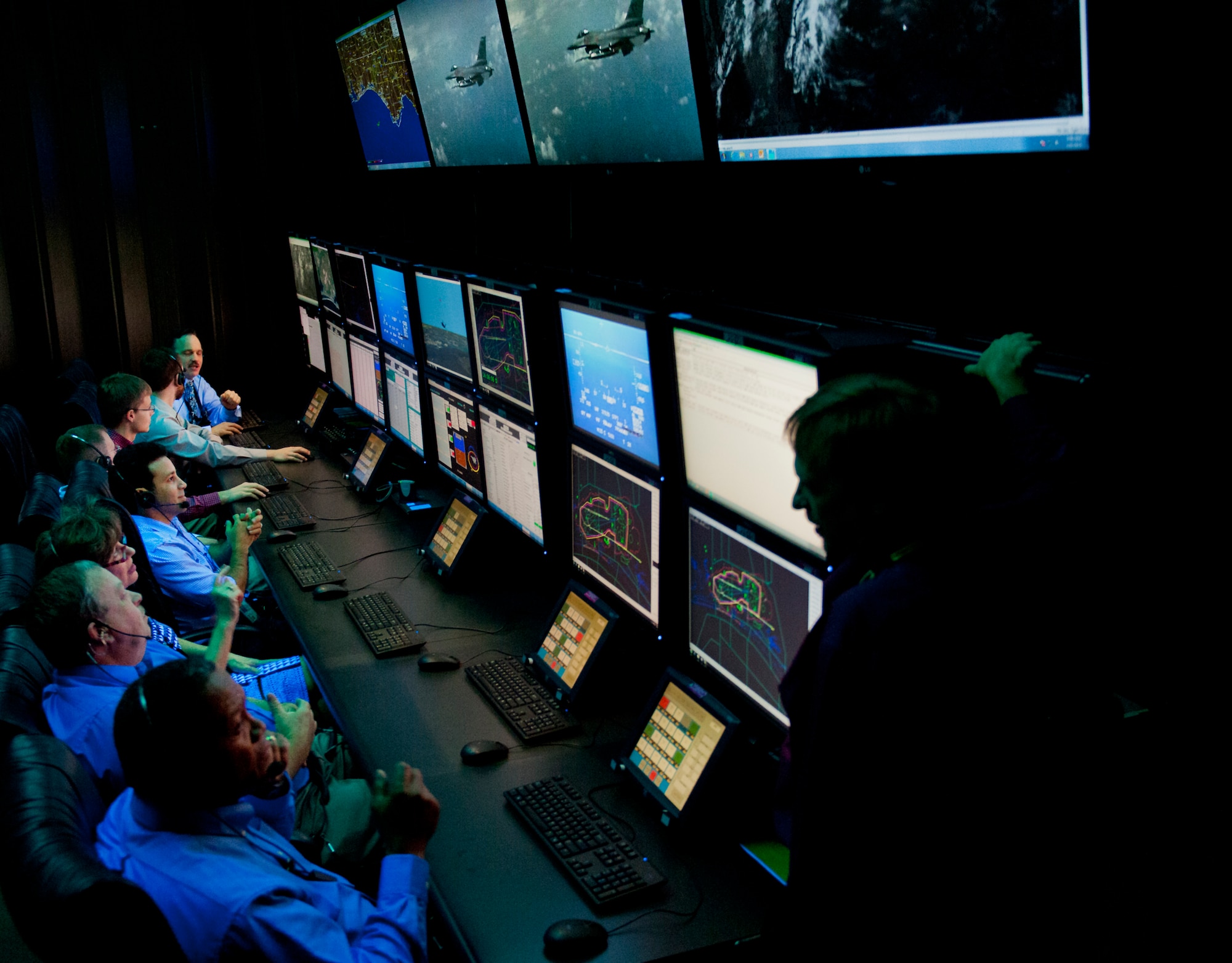Members of the 96th Range Control Squadron monitor a test from the central control facility at Eglin Air Force Base, Fla., April 6.  The 96th RCS through its CCF provides real-time mission control of airborne test and large force training missions on the Eglin Test and Training Range. The CCF is a state-of-the-art facility analogous to NASA’s mission control but on a smaller scale. Operations involve the real-time tracking and control of aircraft and weapons in flight, data collection, and data processing for real-time and post-mission system under test performance analysis. (U.S. Air Force photo/Samuel King Jr.)
