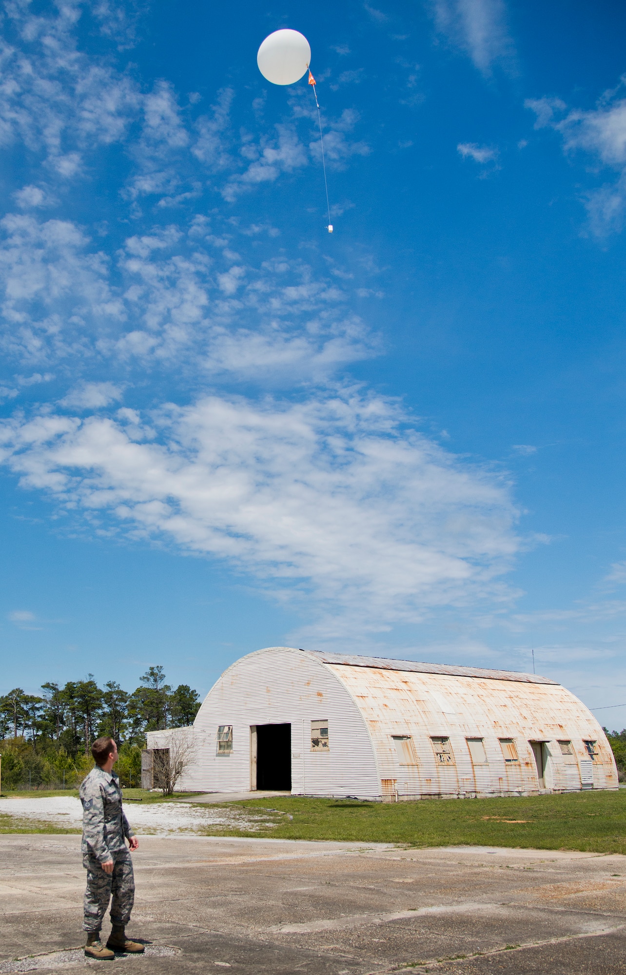 Tech. Sgt. Nathan Halvorson, 96th Weather Flight, releases a weather balloon to gather data for an aircraft test at Eglin Air Force Base, Fla.  (U.S. Air Force photo/Samuel King Jr.)