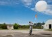 Tech. Sgt. Nathan Halvorson, 96th Weather Flight, releases a weather balloon to gather data for an aircraft test at Eglin Air Force Base, Fla.  (U.S. Air Force photo/Samuel King Jr.)