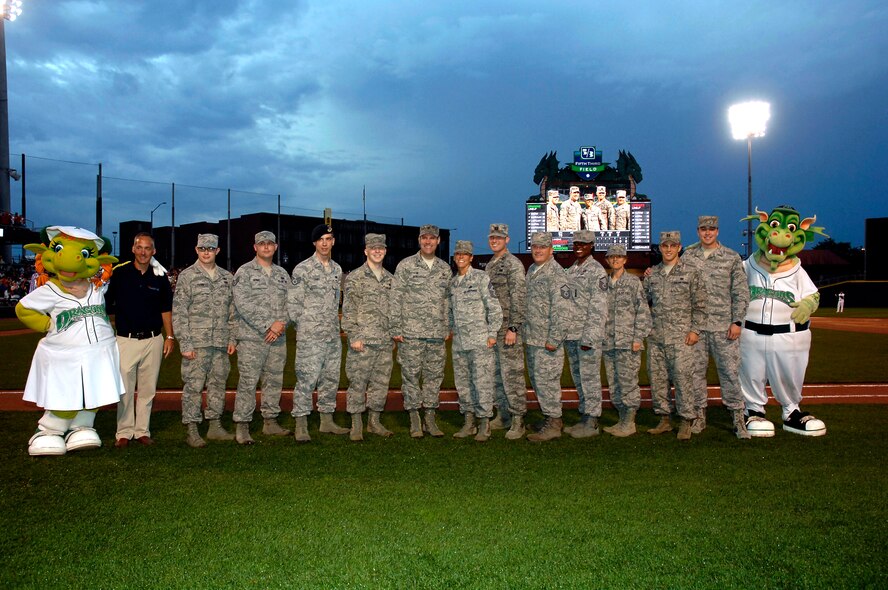 DAYTON, Ohio – The Dayton Development Coalition (DDC) Hometown Heroes with the Dayton Dragons baseball game was May 30, 2015 at Fifth Third Field. Along with a large crowd of active and retired military members, key commanders representing the leadership at Wright-Patterson Air Force Base were in attendance. Between innings, 88th Air Base Wing Commander Col. John Devillier, 88th ABW Command Chief Master Sgt. Lisa Arnold and DDC President Jeff Hoagland recognized WPAFB military personnel, including (third from right) Tech. Sgt. Eugenie Hinson, 445th Airlift Wing history office. (U.S. Air Force photo/Al Bright)