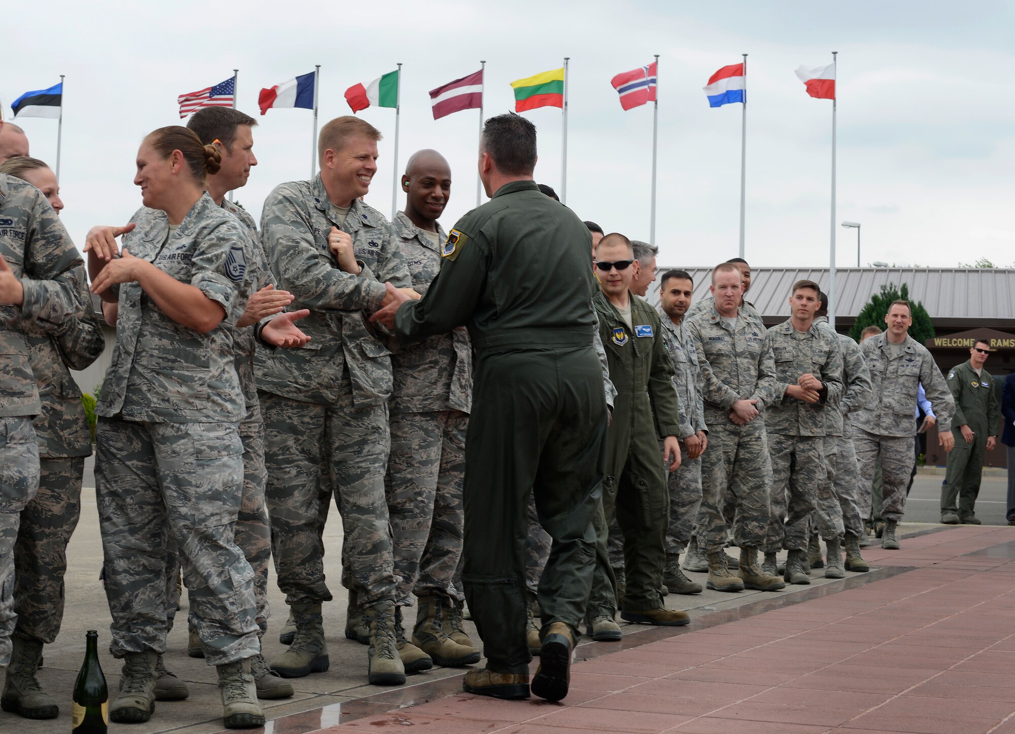 Brig. Gen. Patrick X. Mordente, 86th Airlift Wing commander, shakes hands with Airmen down a receiving line after his final flight on June 10, 2015, at Ramstein Air Base, Germany. Mordente entered the Air Force in 1987 as a graduate of the U.S. Air Force Academy and earned his pilot wings in 1988. Mordente has led six groups and 27 squadrons as the wing commander since June 2013. (U.S. Air Force photo/ 1st Lt. Clay Lancaster).