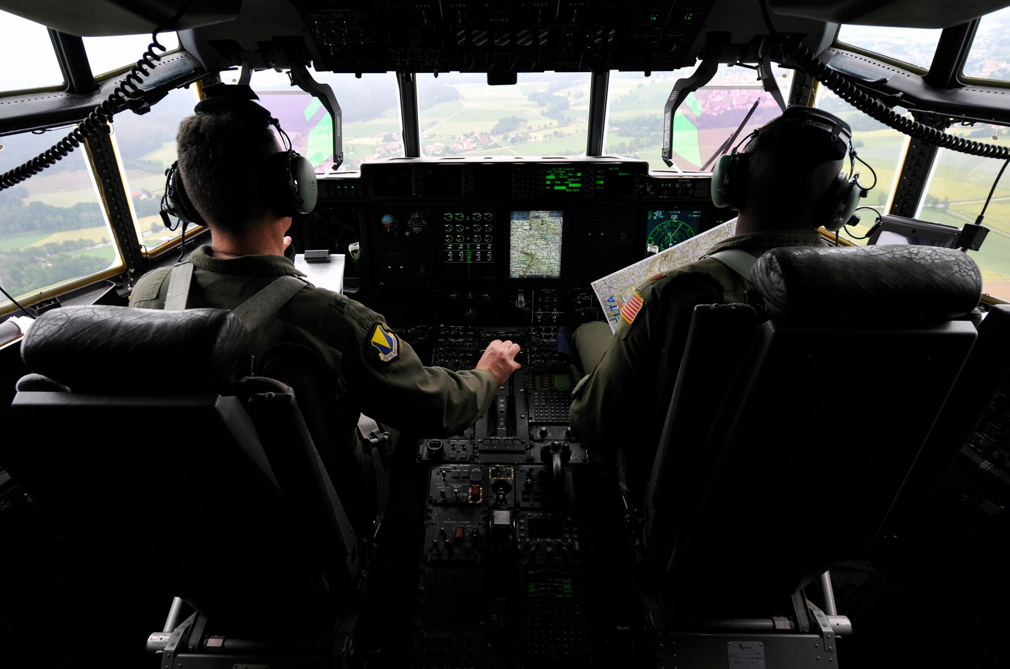 Brig. General Patrick X. Mordente, 86th Airlift Wing commander, and Maj. Jonathan Cato, 37th Airlift Squadron C-130J Super Hercules pilot, fly over the German countryside during Mordente’s final flight on June 10, 2015.  Mordente entered the Air Force in 1987 as a graduate of the U.S. Air Force Academy and earned his pilot wings in 1988. (U.S. Air Force photo/Staff Sgt. Leslie Keopka)  