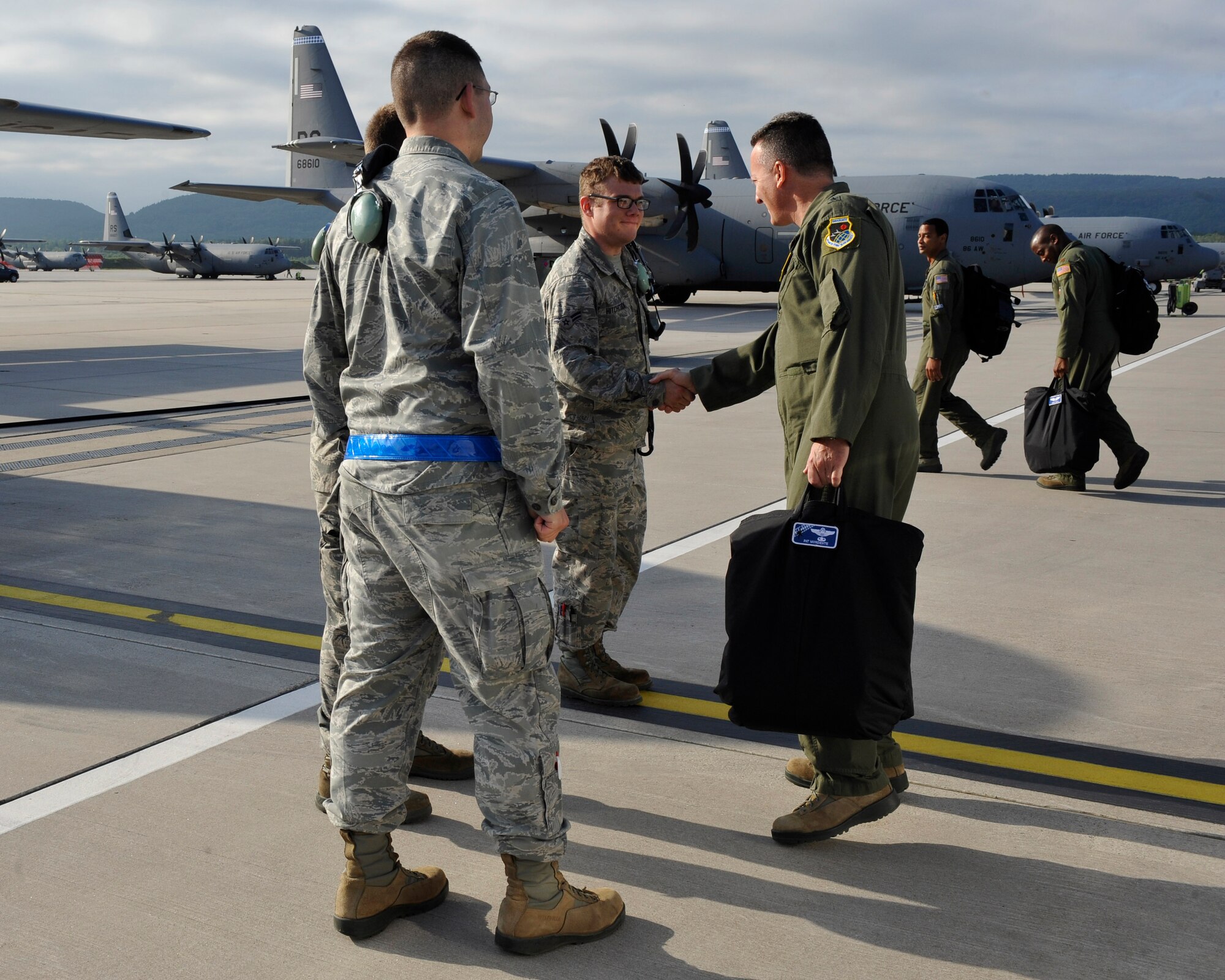 Brig. Gen. Patrick X. Mordente, 86th Airlift Wing commander, shakes hands with aircraft maintainers prior to his final flight on June 10, 2015 at Ramstein Air Base, Germany. Mordente’s final flight took place on the 27th anniversary of his pilot training graduation date. (U.S. Air Force photos/Staff Sgt. Leslie Keopka)