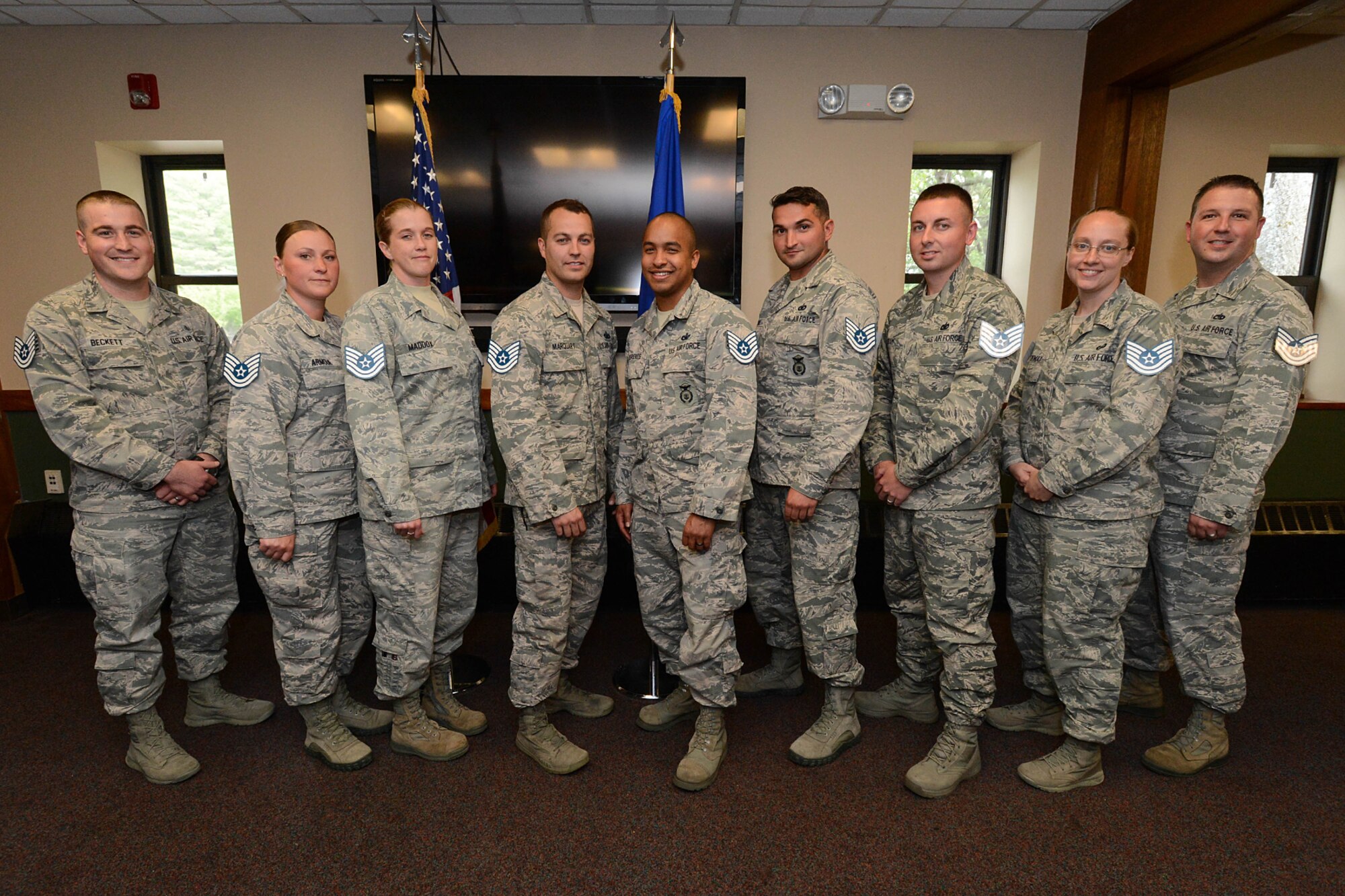Airmen selected for promotion to technical sergeant pose for a group photo following the formal portion of a release ceremony at the Minuteman Commons June 9. Earlier in the day, Air Force officials released the names of 8,446 eligible staff sergeants selected for promotion. Hanscom announced the names of 13 Airmen selected for promotion. (U.S. Air Force photo by Jerry Saslav)