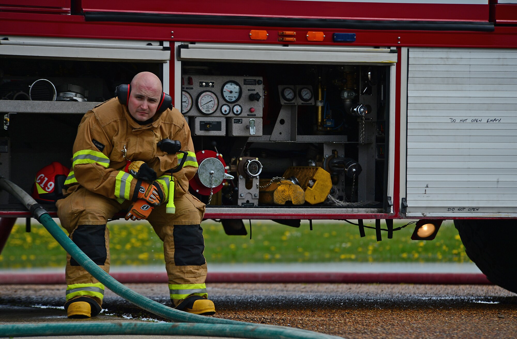 Tech. Sgt. Kevin Coughlin, 48th Civil Engineer Squadron firefighter and station chief, observes a training exercise on the flightline during a spouse day at Royal Air Force Lakenheath, England, May 1, 2015. Coughlin was nominated for a Liberty Spotlight because he embodies the core value of Excellence In All We Do. (U.S. Air Force photo by Senior Airman Erin O’Shea/Released)