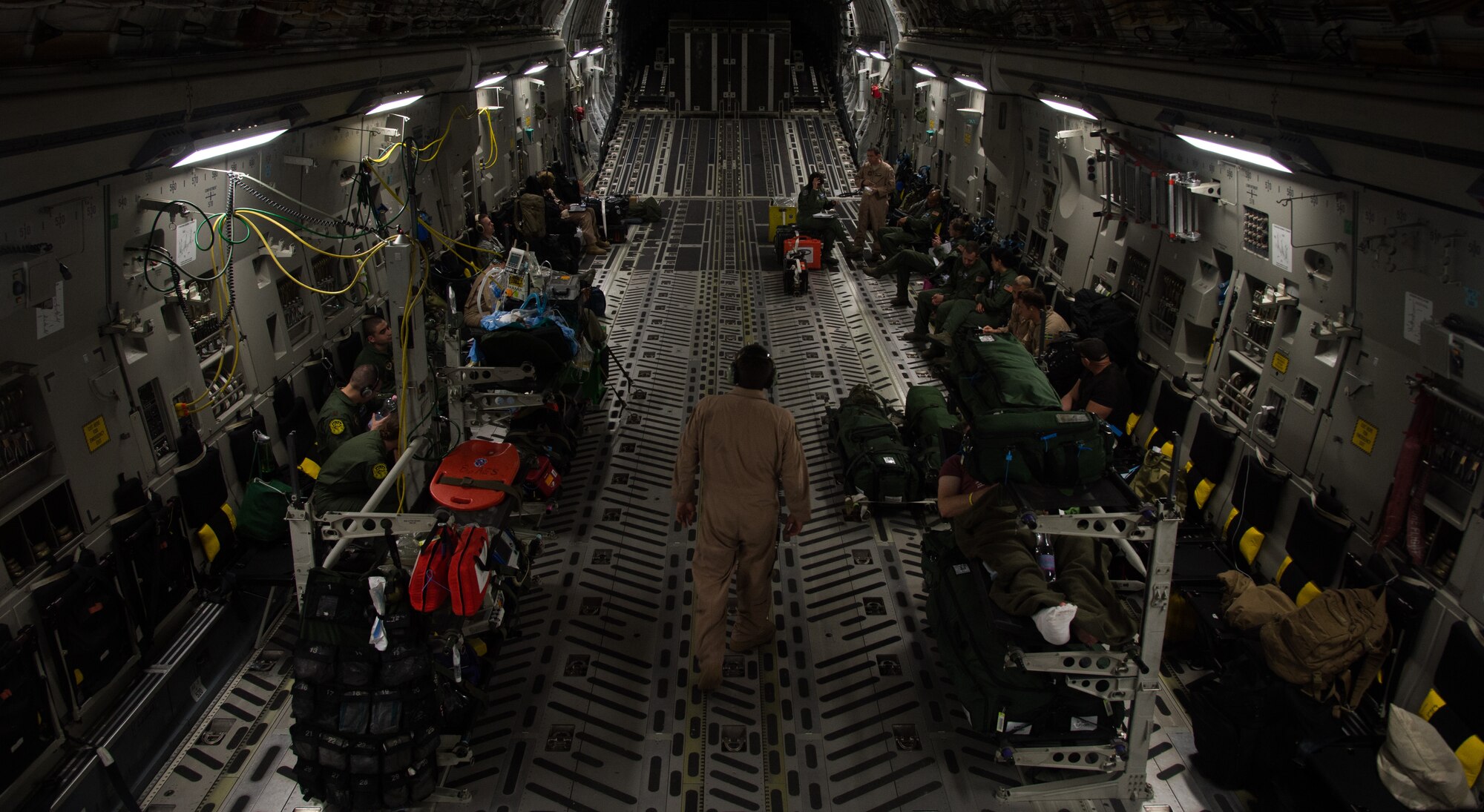 Airmen from Strategic Airlift Capability Heavy Airlift Wing from Pápa Air Base, Hungary and Ramstein Air Base, Germany, provide in-flight care and transport for wounded patients June 8, 2015, above Europe. The patients were headed to Ramstein and Landstuhl Regional Medical Center to receive additional medical care. This was the first time both bases joined together for a critical care aeromedical transport. (U.S. Air Force photo/Senior Airman Jonathan Stefanko)