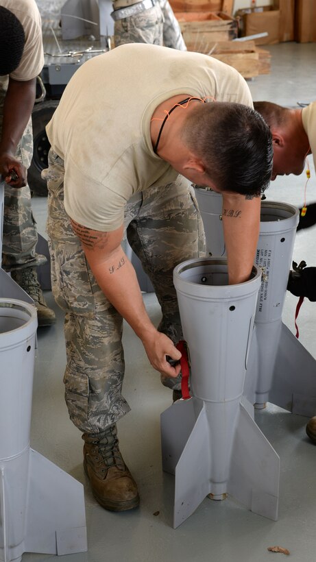 Staff Sgt. Erik Sands, munitions crew chief deployed to 36th Munitions Squadron from Barksdale AFB, La., installs an ATU-35 drive assembly into a BSU-33 conical fin that is used with a Mark 82 bomb during the 2015 Combat Ammunition Production Exercise,  June 2, 2015, Andersen Air Force Base, Guam. During the five-day Pacific Air Forces exercise, munitions specialists produced various live munitions at large, real-life quantities in support of simulated combat sorties from Andersen AFB's flightline. (U.S. Air Force photo by Airman 1st Class Joshua Smoot/Released)