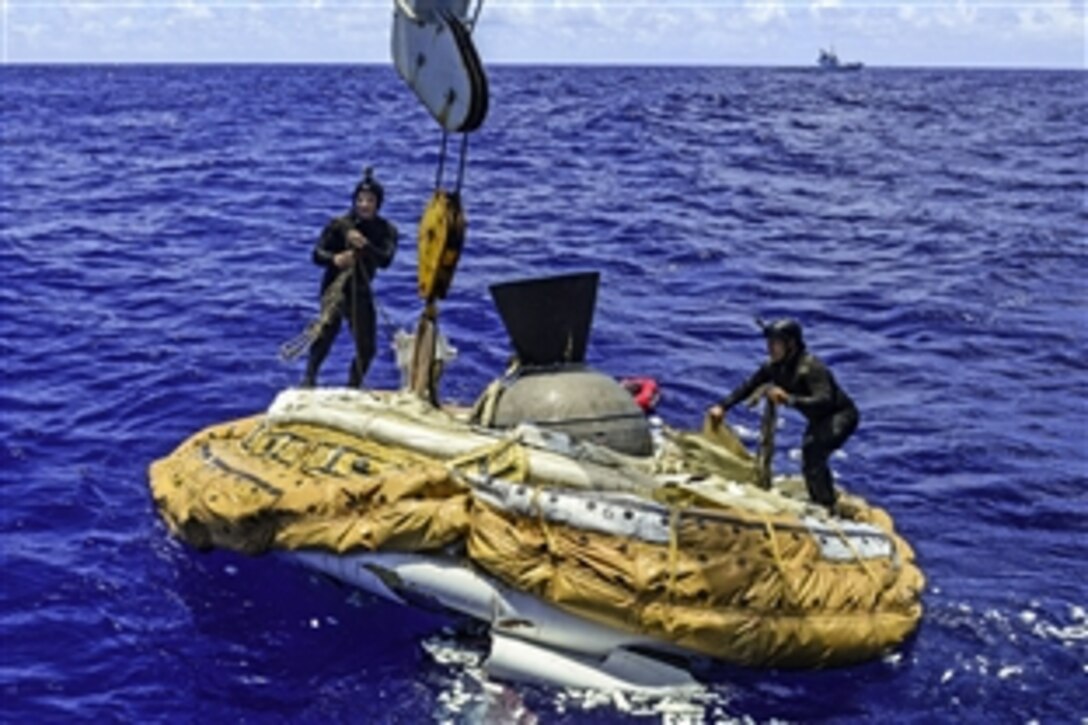 Sailors recover the test vehicle for NASA's low-density supersonic decelerator off the coast of the Navy's Pacific Missile Range Facility on Kauai, Hawaii, June 8, 2015. The vehicle is part of a project to investigate and test technologies to land future robotics and humans on Mars, and safely return large payloads to Earth. The sailors are assigned to Mobile Diving and Salvage Unit 1.
