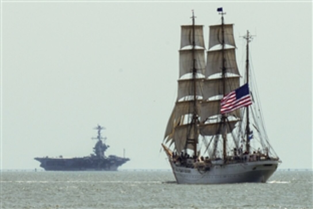 The Coast Guard Cutter Eagle, foreground, sails in the Chesapeake Bay near Norfolk, Va., June 8, 2015. The Eagle's crew recently participated in the 39th annual Norfolk Harborfest.