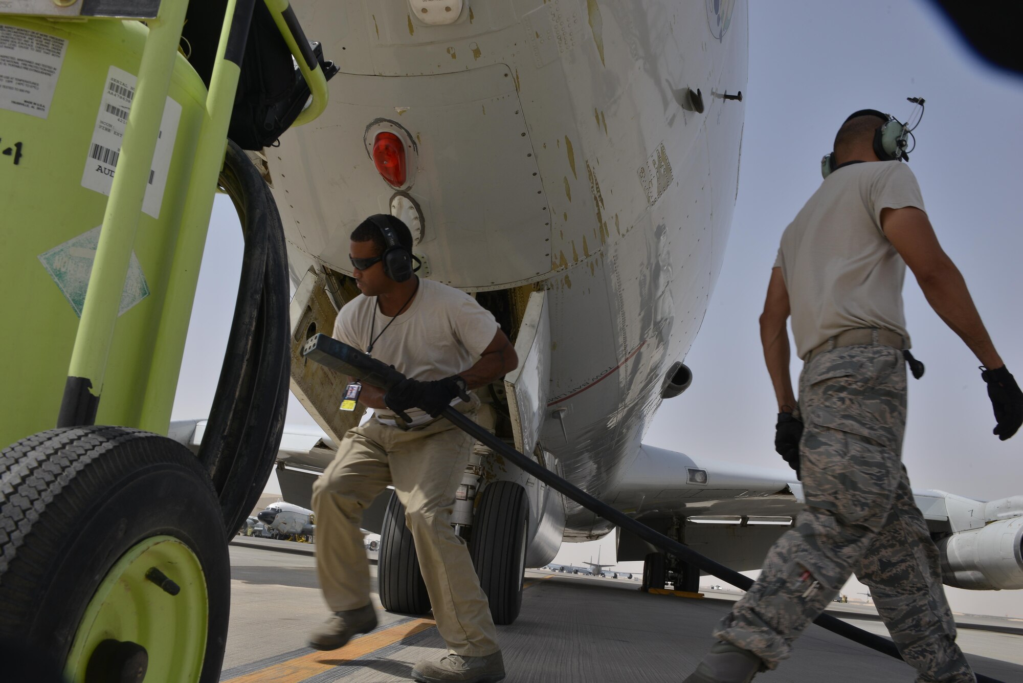 Airman from the 7th Expeditionary Air Mobility Unit prepare a Boeing E-8C Joint Surveillance Target Attack Radar Systems aircraft for maintenance checks after completing its 100K combat hours milestone mission June 2, 2015 Al Udeid Air Base, Qatar. The E-8C JSTARS and its active duty, guard and reserve service members conduct missions overseas to support operations on the war on terror. During this time JSTARS completed 100K combat hours by continually flying 24/7 for 11.4 years. (U.S. Air Force photo/Staff Sgt. Alexandre Montes)