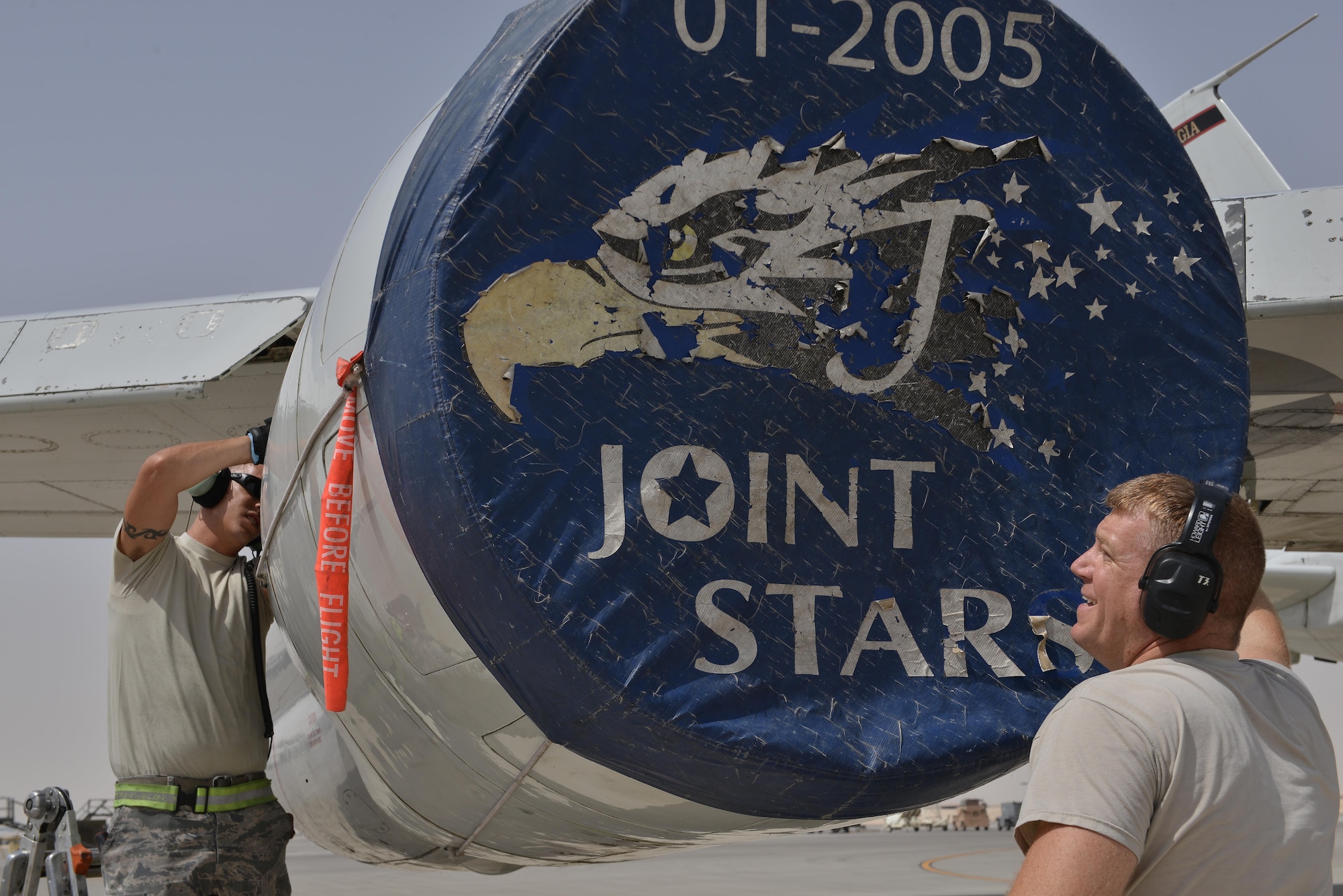 Airmen from the 7th Air Mobility Unit maintenance cover the engines of a Boeing E-8C Joint Surveillance Target Attack Radar Systems June 2, 2015 Al Udeid Air Base, Qatar. The E-8C JSTARS and its active duty, guard and reserve service members conduct missions overseas to support operations on the war on terror. During this time JSTARS completed 100K combat hours by continually flying 24/7 for 11.4 years. (U.S. Air Force photo/Staff Sgt. Alexandre Montes)) 