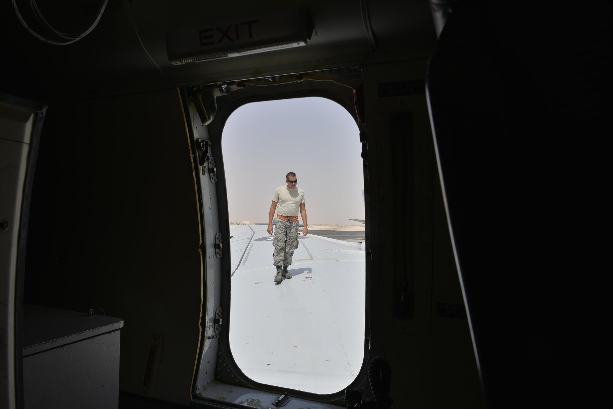 An Airman from the 7th Expeditionary Air Mobility Unit performs a routine post-flight maintenance inspection on the wing of a Boeing E-8C Joint Surveillance Target Attack Radar Systems for damages and minor repairs June 2, 2015 at Al Udeid Air Base, Qatar. The E-8C JSTARS and its active duty, guard and reserve service members conduct missions overseas to support operations on the war on terror. During this time JSTARS completed 100K combat hours by continually flying 24/7 for 11.4 years. (U.S. Air Force photo/Staff Sgt. Alexandre Montes)