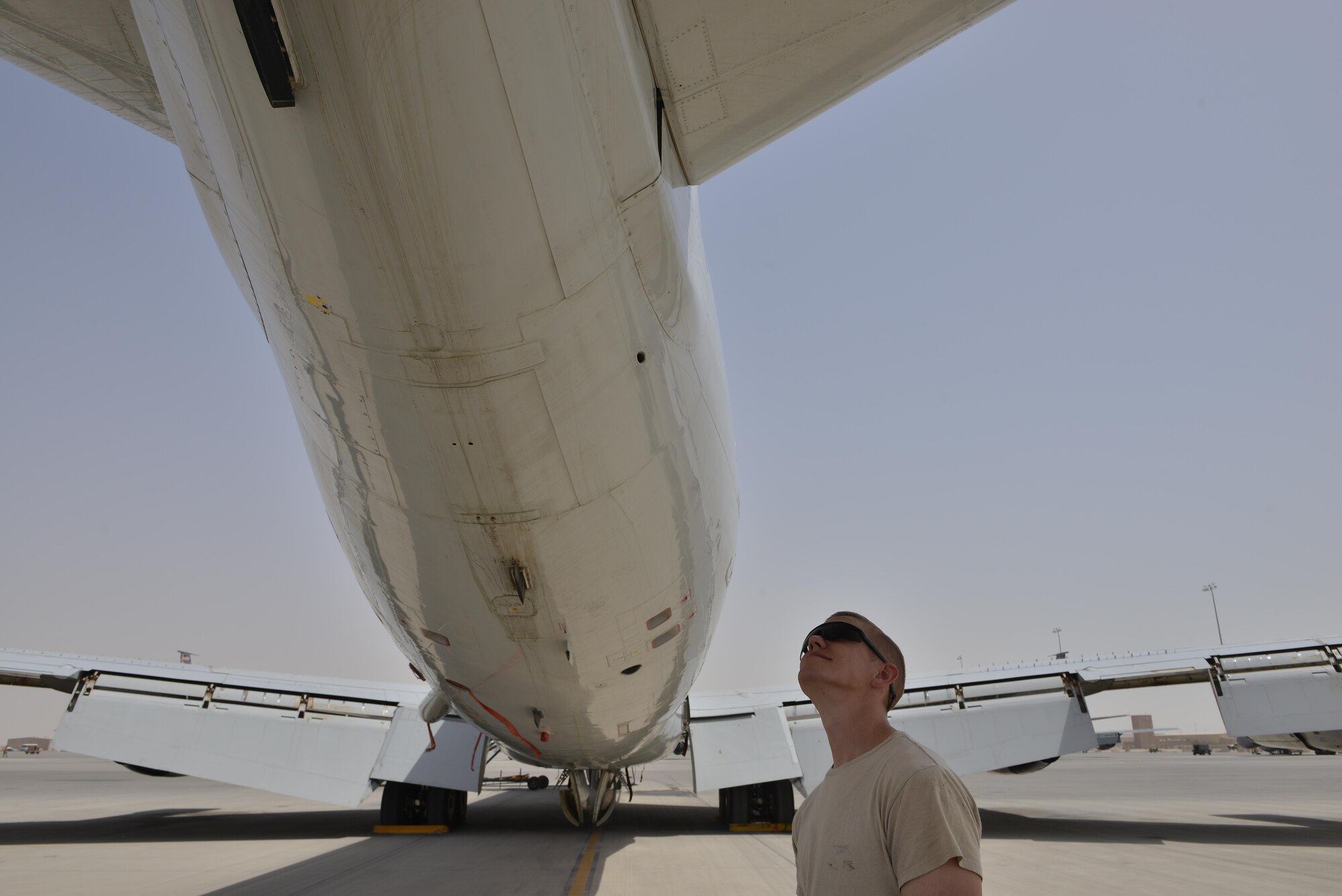 A 7th Expeditionary Air Mobility Unit maintenance airmen checks for damages and minor repairs on a Boeing E-8C Joint Surveillance Target Attack Radar Systems June 2, 2015 Al Udeid Air Base, Qatar. The E-8C JSTARS and its active duty, guard and reserve service members conduct missions overseas to support operations on the war on terror. During this time JSTARS completed 100K combat hours by continually flying 24/7 for 11.4 years. (U.S. Air Force photo/Staff Sgt. Alexandre Montes)