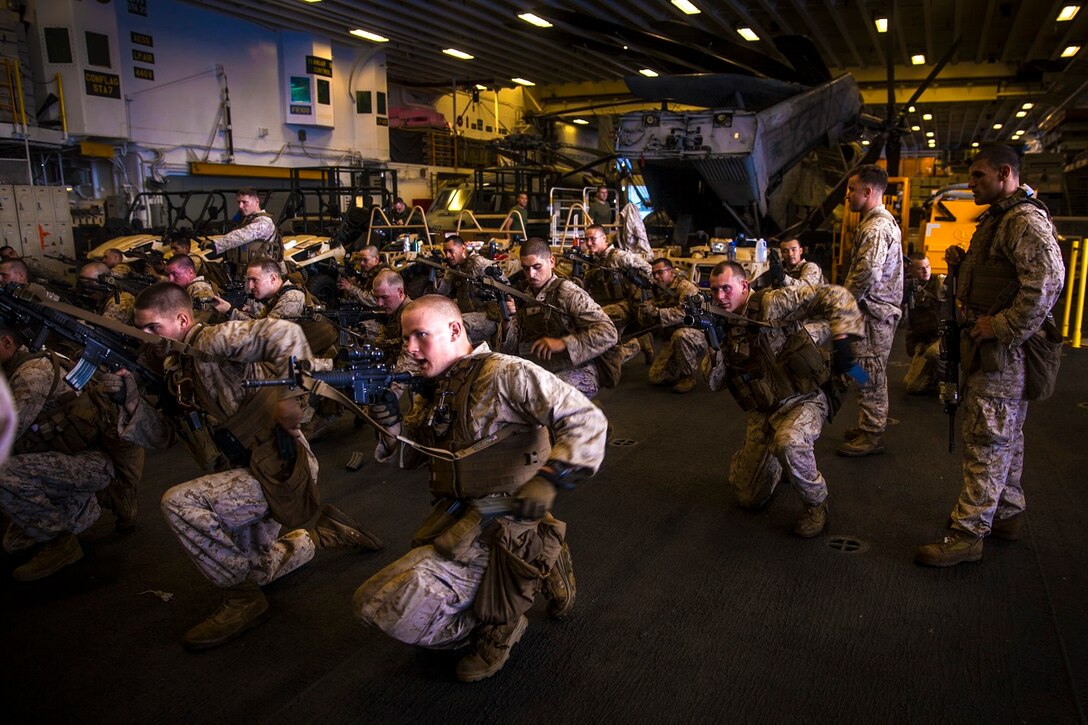U.S. Marines on board a landing craft, air cushion embark onto the USS Essex (LHD 2) during Amphibious Squadron Three/Marine Expeditionary Unit Integration Training (PMINT) aboard Naval Station San Diego Feb. 23, 2015. The 15th MEU is embarked aboard the three ships of the Essex Amphibious Ready Group - the USS Essex, USS Anchorage (LPD 23), and USS Rushmore (LSD 47) – during PMINT to continue integrating and training with the PHIBRON and ship staffs as they prepare for deployment later this spring. (U.S. Marine Corps photo by Cpl. Elize McKelvey/Released)