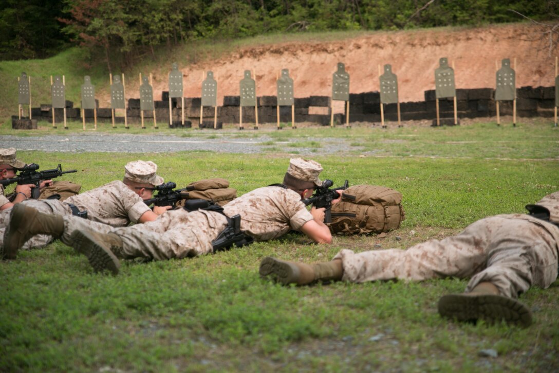 Guard Marines from Marine Barracks Washington, D.C., shoot M4 service rifles during a training exercise at Range 5, Marine Corps Base Quantico, Va., June 10, 2015. 1st platoon, Guard Company, traveled to Quantico, Va., to increase overall marksmanship with the M9 service pistol, the M4 service rifle and M1014 shotgun. “By the time these Marines leave Guard Company we are hoping that they have mastered the fundamentals of marksmanship,” said Capt. Greg Jurschak, 1st platoon commander, Guard Co. “We also want to hone their decision making and judgment skills. It’s not only having good fundamentals it is knowing the right place, the right time and the right reason to actually employ their weapons.”