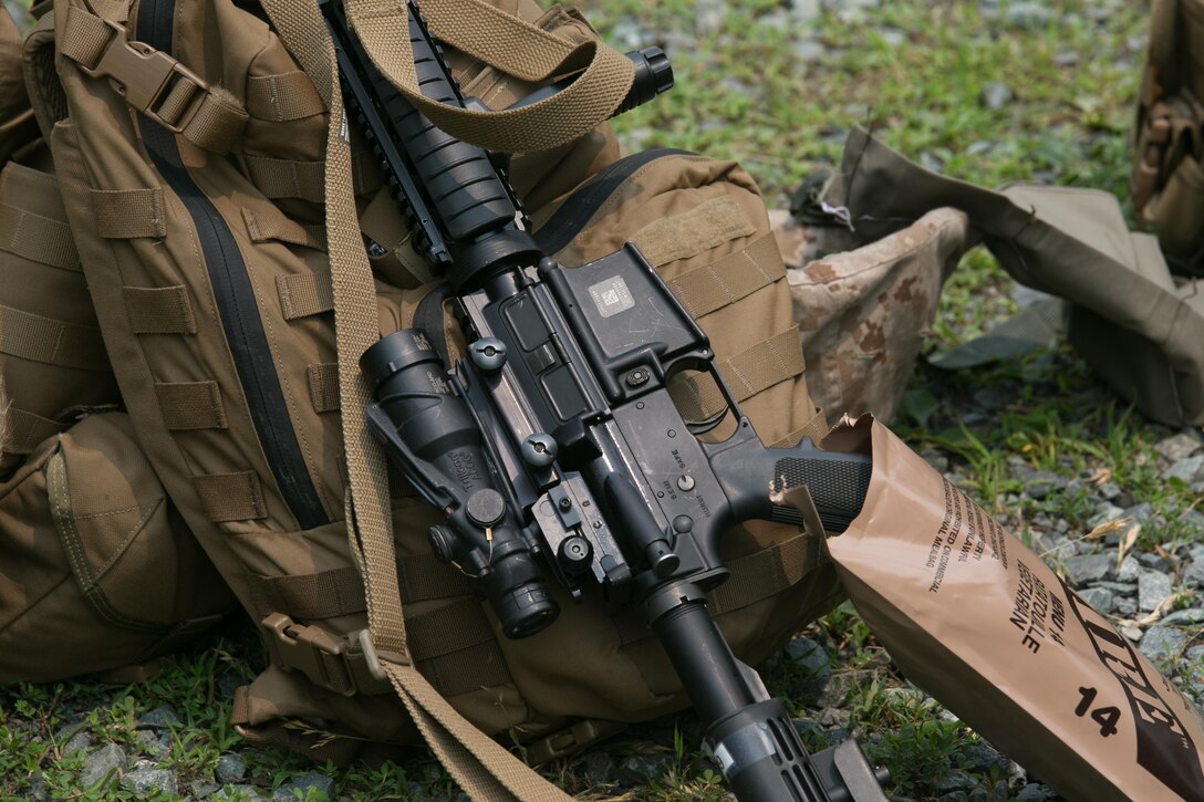 An M4 service rifle is staged during a training exercise at Range 5, Marine Corps Base Quantico, Va., June 10, 2015. 1st platoon, Guard Company, traveled to Quantico, Va., to increase overall marksmanship with the M9 service pistol, the M4 service rifle and M1014 shotgun. “By the time these Marines leave Guard Company we are hoping that they have mastered the fundamentals of marksmanship,” said Capt. Greg Jurschak, 1st platoon commander, Guard Co. “We also want to hone their decision making and judgment skills. It’s not only having good fundamentals it is knowing the right place, the right time and the right reason to actually employ their weapons.”